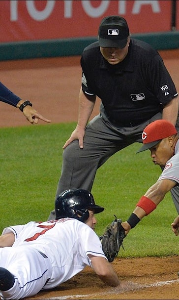Reds get assist from bullpen wild pitch